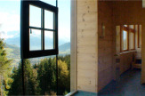 Holzhotel Forsthofalm, Leogang - Spanorama: Sauna mit Bergblick / Zum Vergrößern auf das Bild klicken